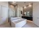 Spa-like bathroom featuring a soaking tub and a separate shower at 11972 E Yearling Rd # 20, Scottsdale, AZ 85255