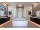 Spa-like bathroom with soaking tub and dual vanities at 11972 E Yearling Rd # 20, Scottsdale, AZ 85255