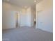 Spacious bedroom with plush carpeting and access to bathroom at 11972 E Yearling Rd # 20, Scottsdale, AZ 85255