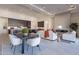 Open concept dining area with modern table and chairs, adjacent to kitchen at 11972 E Yearling Rd # 20, Scottsdale, AZ 85255