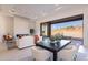 Open living area with fireplace, sliding glass doors, and modern decor at 11972 E Yearling Rd # 20, Scottsdale, AZ 85255