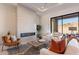 Spacious living room with fireplace, large windows, and comfortable seating at 11972 E Yearling Rd # 20, Scottsdale, AZ 85255