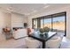 Open living space with fireplace, sliding doors to patio, and modern furniture at 11972 E Yearling Rd # 20, Scottsdale, AZ 85255