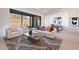 Bright and spacious living room with large windows and modern furniture at 11972 E Yearling Rd # 20, Scottsdale, AZ 85255