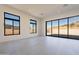 Bright living room with sliding glass doors leading to the backyard at 11972 E Yearling Rd # 20, Scottsdale, AZ 85255