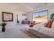 Main bedroom with access to private patio and sitting area at 11972 E Yearling Rd # 20, Scottsdale, AZ 85255