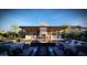 Luxury pool with outdoor kitchen, waterfall feature, and mountain views at 11972 E Yearling Rd # 20, Scottsdale, AZ 85255