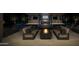 Outdoor pool with fire pit and kitchen area featuring grill, refrigerator, and television at 11972 E Yearling Rd # 20, Scottsdale, AZ 85255