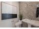 Elegant powder room with modern sink and herringbone tile at 11972 E Yearling Rd # 20, Scottsdale, AZ 85255