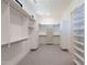 Large walk-in closet with built-in shelves and drawers at 11972 E Yearling Rd # 20, Scottsdale, AZ 85255