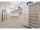 Bright walk-in closet offering custom shelving and hanging space at 11972 E Yearling Rd # 20, Scottsdale, AZ 85255
