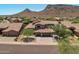 Two-story home with a two-car garage and mountain views at 14035 E Sahuaro Dr, Scottsdale, AZ 85259