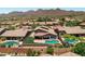 Aerial view of community with multiple homes and pools at 14035 E Sahuaro Dr, Scottsdale, AZ 85259