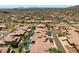 Aerial view of community with desert landscape and homes at 14035 E Sahuaro Dr, Scottsdale, AZ 85259