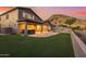 Spacious backyard with artificial turf, hot tub, and mountain views at 14035 E Sahuaro Dr, Scottsdale, AZ 85259