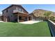 Landscaped backyard with pool and artificial turf at 14035 E Sahuaro Dr, Scottsdale, AZ 85259