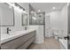Contemporary bathroom with a walk-in shower and floating vanity at 14035 E Sahuaro Dr, Scottsdale, AZ 85259