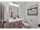 Small bathroom with single vanity and toilet at 14035 E Sahuaro Dr, Scottsdale, AZ 85259