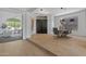 Elegant dining room with modern light fixture and hardwood floors at 14035 E Sahuaro Dr, Scottsdale, AZ 85259