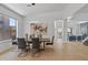 Modern dining room with a large table and hardwood floors at 14035 E Sahuaro Dr, Scottsdale, AZ 85259