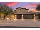 Two-story house with a three-car garage and desert landscaping at 14035 E Sahuaro Dr, Scottsdale, AZ 85259