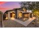 Two-story home with arched entryway and walkway leading to the front door at 14035 E Sahuaro Dr, Scottsdale, AZ 85259