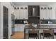Modern kitchen with white cabinets, stainless steel appliances, and a dark-colored island at 14035 E Sahuaro Dr, Scottsdale, AZ 85259