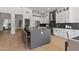 Modern kitchen with white cabinets, stainless steel appliances, and a large island at 14035 E Sahuaro Dr, Scottsdale, AZ 85259