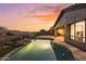 Stunning backyard oasis featuring a large pool, flagstone patio, and mountain views at 14035 E Sahuaro Dr, Scottsdale, AZ 85259