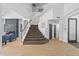 Modern staircase with metal railing and wood flooring at 14035 E Sahuaro Dr, Scottsdale, AZ 85259