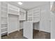 Spacious walk-in closet with ample shelving and hanging space at 14035 E Sahuaro Dr, Scottsdale, AZ 85259
