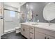 Modern bathroom with double vanity, gray walls, and hexagon tile floor at 1642 E Monte Vista Rd # 4, Phoenix, AZ 85006
