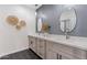 Modern bathroom with double vanity, gray walls, and hexagon tile floor at 1642 E Monte Vista Rd # 4, Phoenix, AZ 85006