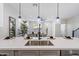 Modern kitchen with white cabinets, quartz countertops, and stainless steel sink at 1642 E Monte Vista Rd # 4, Phoenix, AZ 85006