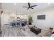 Open floor plan with modern kitchen island, stainless steel appliances, and cozy living area at 1642 E Monte Vista Rd # 4, Phoenix, AZ 85006