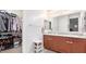 Bathroom with double vanity and large walk-in shower at 17536 W Desert Bloom St, Goodyear, AZ 85338
