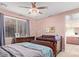 Spacious bedroom with a crib and ensuite bathroom access at 17536 W Desert Bloom St, Goodyear, AZ 85338