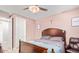 Bedroom with wooden bed frame and additional seating at 17536 W Desert Bloom St, Goodyear, AZ 85338