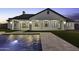 Elegant backyard with a pool, spa, travertine tile, and covered patio at 19912 E Karsten Dr, Queen Creek, AZ 85142