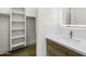 Chic bathroom boasting marble countertop, a lighted mirror, and a built-in closet at 19912 E Karsten Dr, Queen Creek, AZ 85142