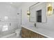Modern bathroom with a glass enclosed shower, stone flooring, and a vanity with marble countertop at 19912 E Karsten Dr, Queen Creek, AZ 85142