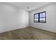 Bright bedroom with hardwood floors, recessed lighting, and a large window offering natural light at 19912 E Karsten Dr, Queen Creek, AZ 85142