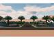 Scenic community entrance with palm trees, manicured landscaping, and elegant signage at 19912 E Karsten Dr, Queen Creek, AZ 85142