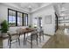 Elegant dining room with coffered ceiling, modern table, and large windows offering outdoor views at 19912 E Karsten Dr, Queen Creek, AZ 85142