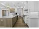Gourmet kitchen boasts stainless steel appliances, custom cabinets, and a large center island at 19912 E Karsten Dr, Queen Creek, AZ 85142