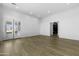 Spacious living room with hardwood floors, recessed lighting, and glass doors opening to the backyard at 19912 E Karsten Dr, Queen Creek, AZ 85142