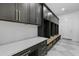 Well-organized mudroom with custom lockers, built-in bench, and ample storage space for coats and shoes at 19912 E Karsten Dr, Queen Creek, AZ 85142