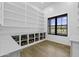 Bright pantry with white cabinets and shelving, marble countertops, and black frame window at 19912 E Karsten Dr, Queen Creek, AZ 85142