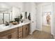 Spa-like bathroom with dual vanities and walk-in closet at 20622 N 226Th Ln, Surprise, AZ 85387