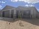 Charming single-story home with neutral paint, rock accents, and a well-kept xeriscaped yard at 20622 N 226Th Ln, Surprise, AZ 85387